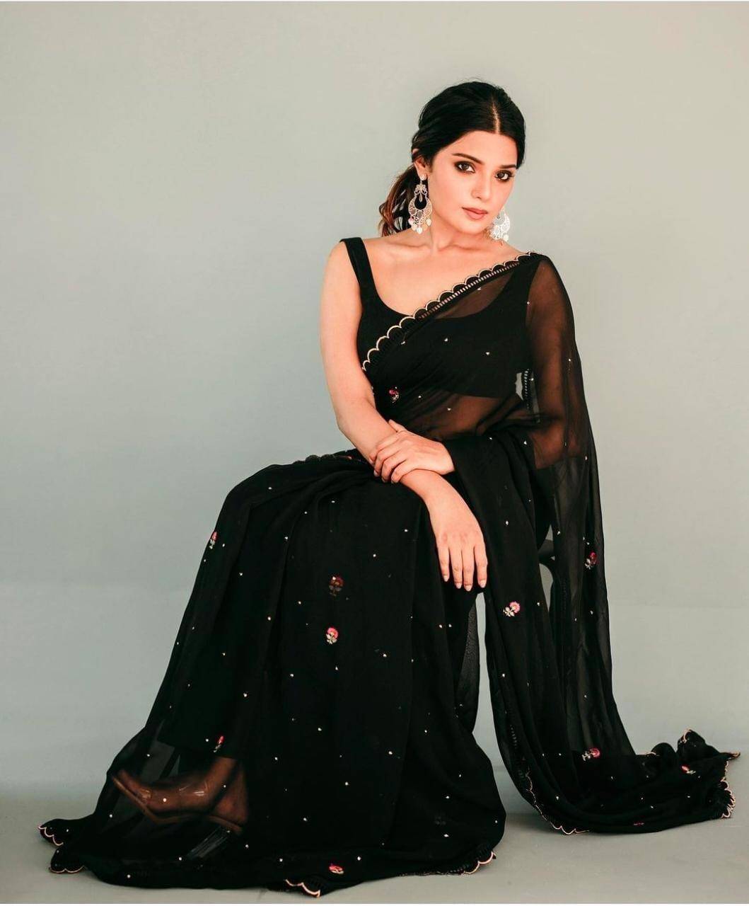 Actress Aathmika Looks ethereal as she casts a spell in a black georgette saree