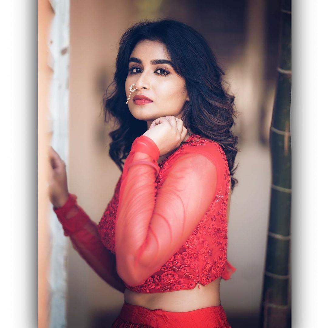 Actress Reshma Riya looks sensuous while she slays in a sheer red gown