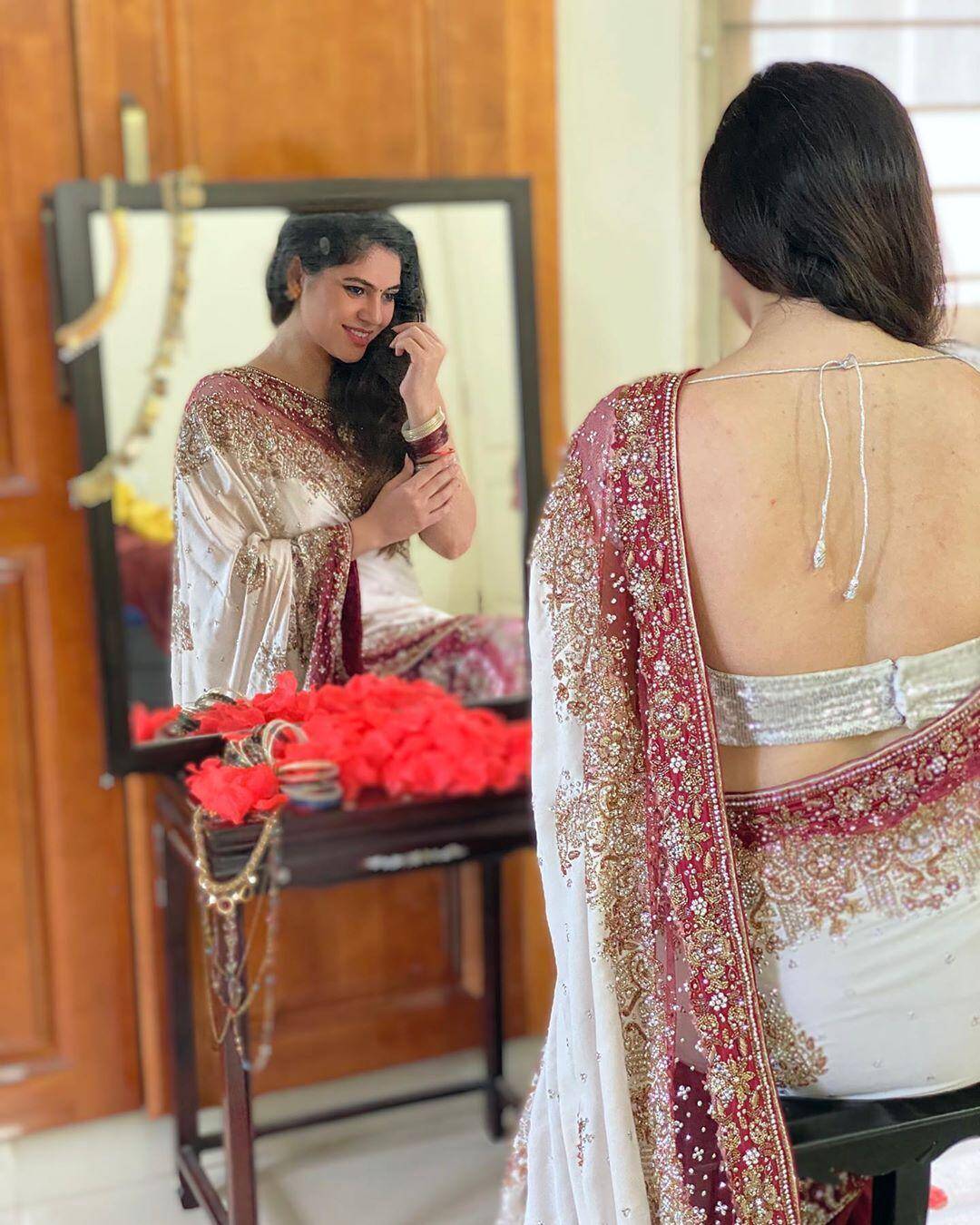 Actress Sherin looks angelic in an embellished white saree