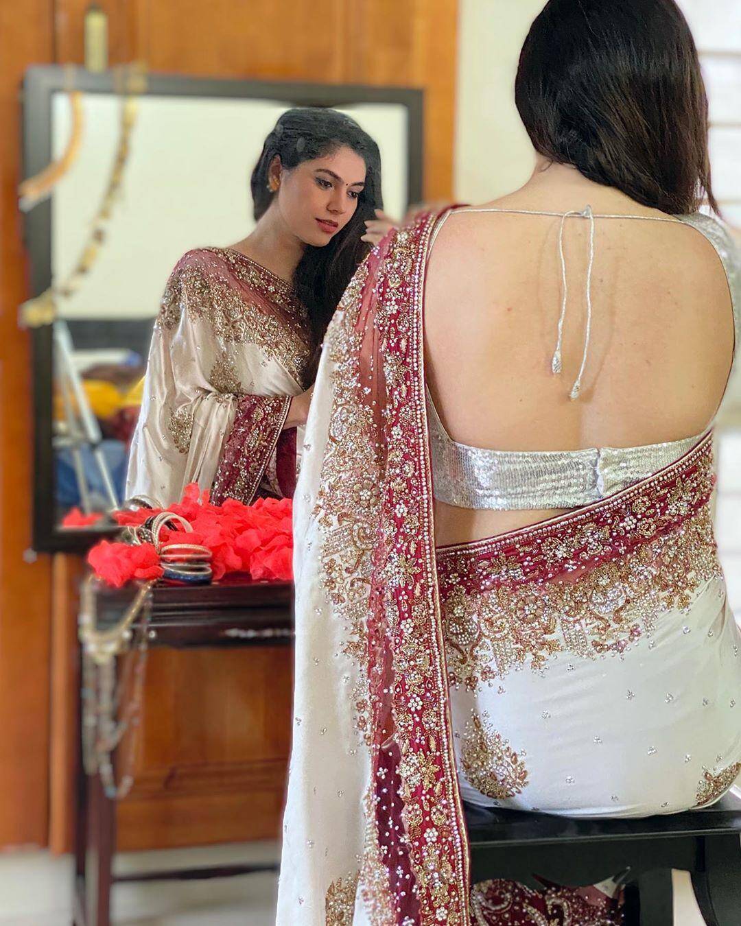 Actress Sherin looks angelic in an embellished white saree